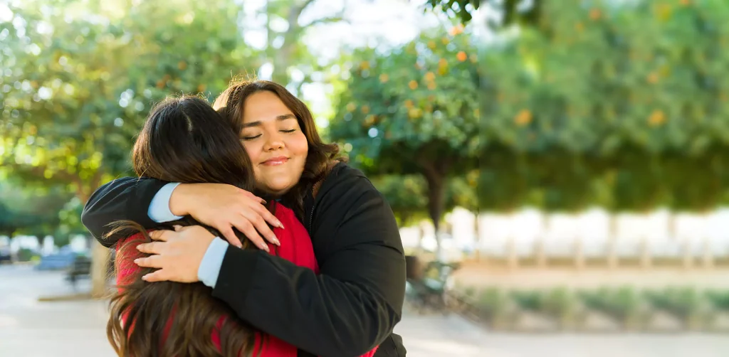 Two women hugging